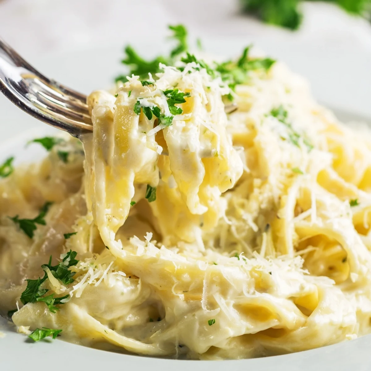 Serving suggestion of Creamy Dinner Pasta in a warm bowl, topped with fresh parsley and grated Parmesan.