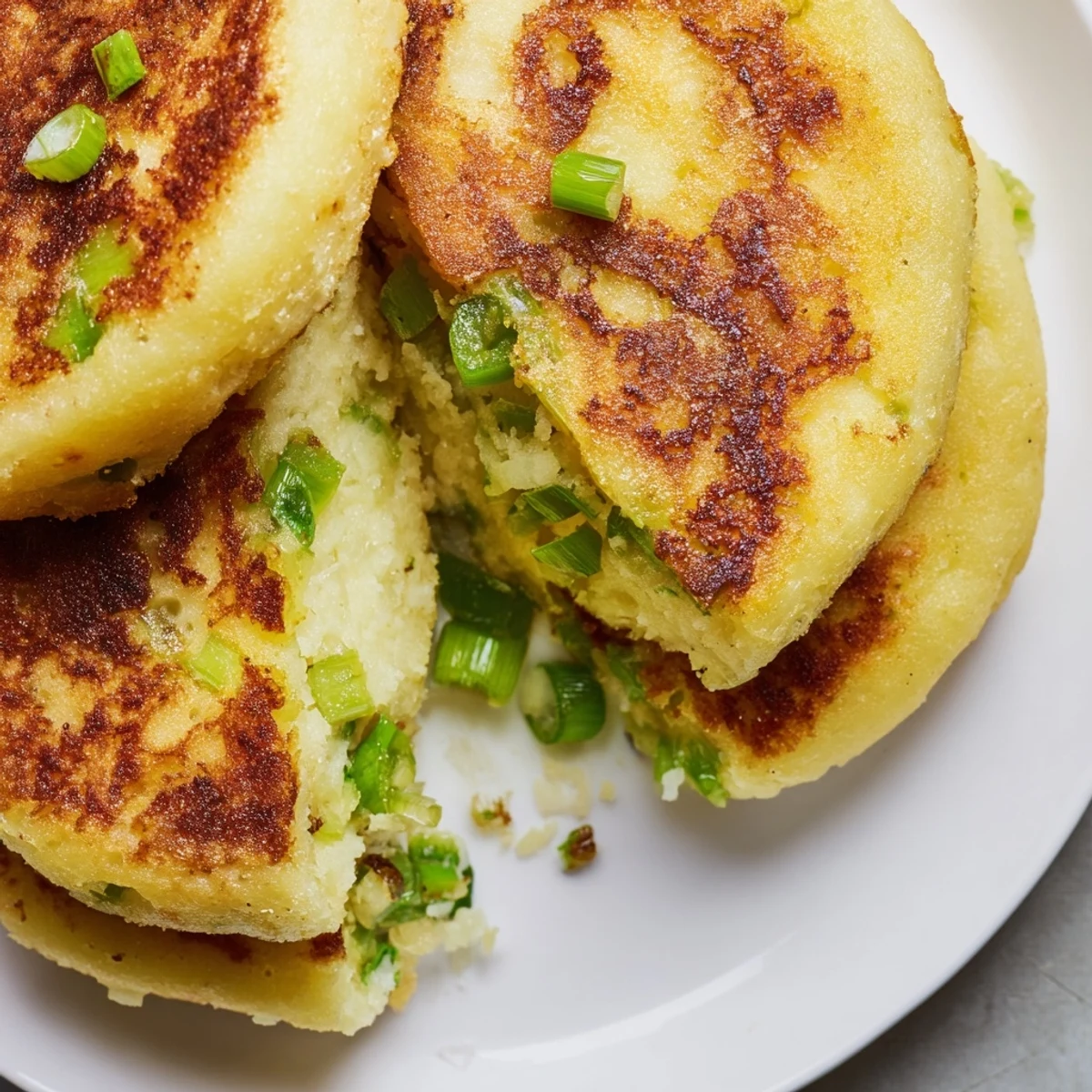 Soft, fluffy Irish Potato Cakes with Scallions on a wooden board, ready to enjoy for breakfast.