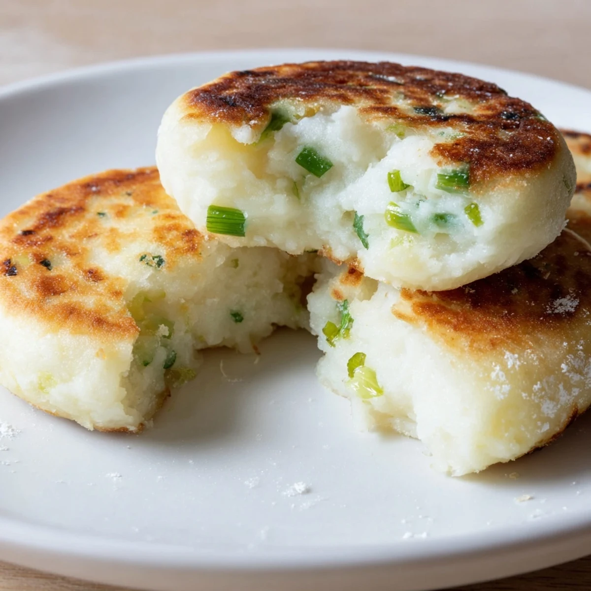 Freshly chopped scallions flavor these Irish Potato Cakes with Scallions, a vegetarian side dish perfect with eggs or salmon.  