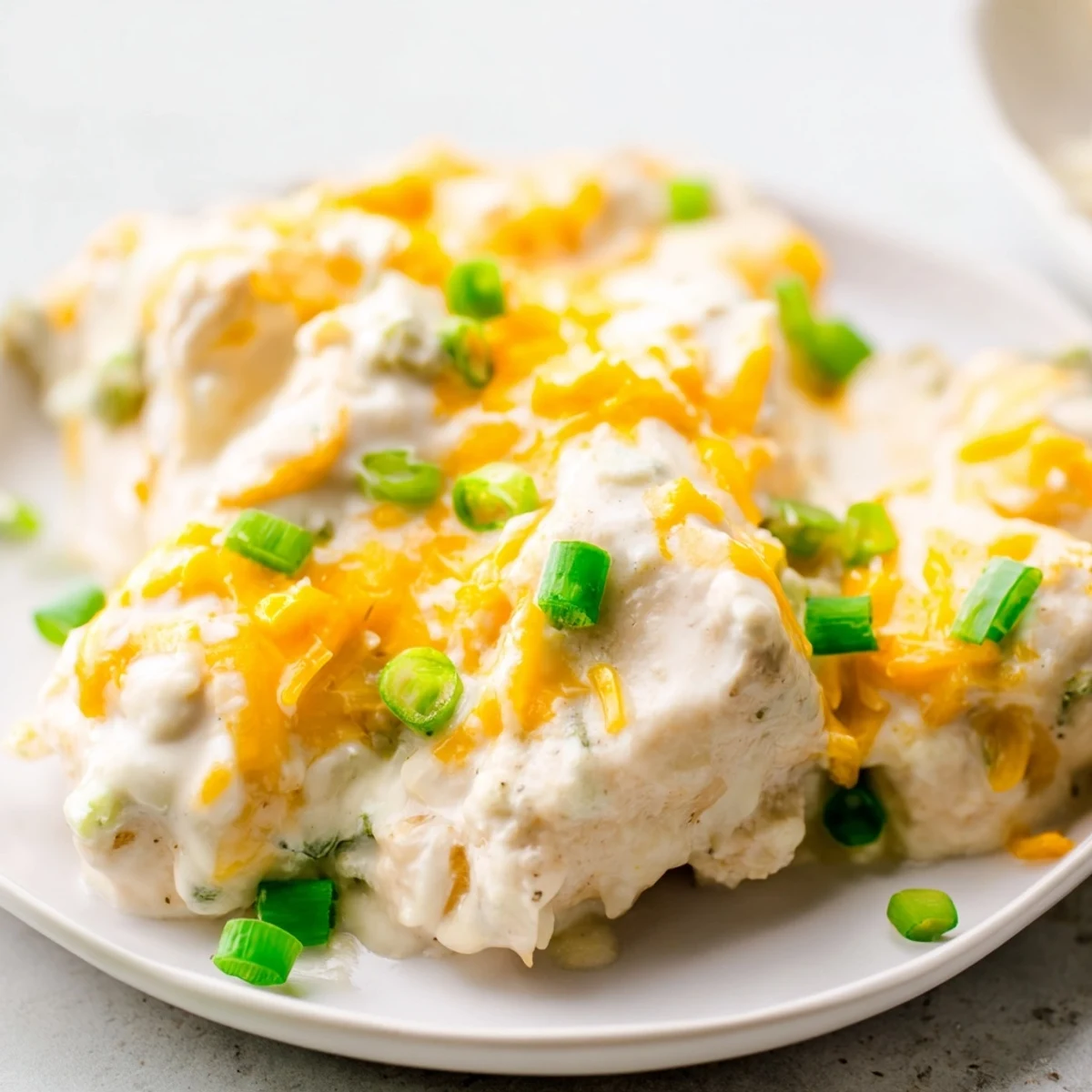Golden-baked chicken breasts smothered in creamy sour cream and onion sauce, topped with melted cheddar cheese. This Sour Cream and Onion Chicken is a comforting weeknight dinner.