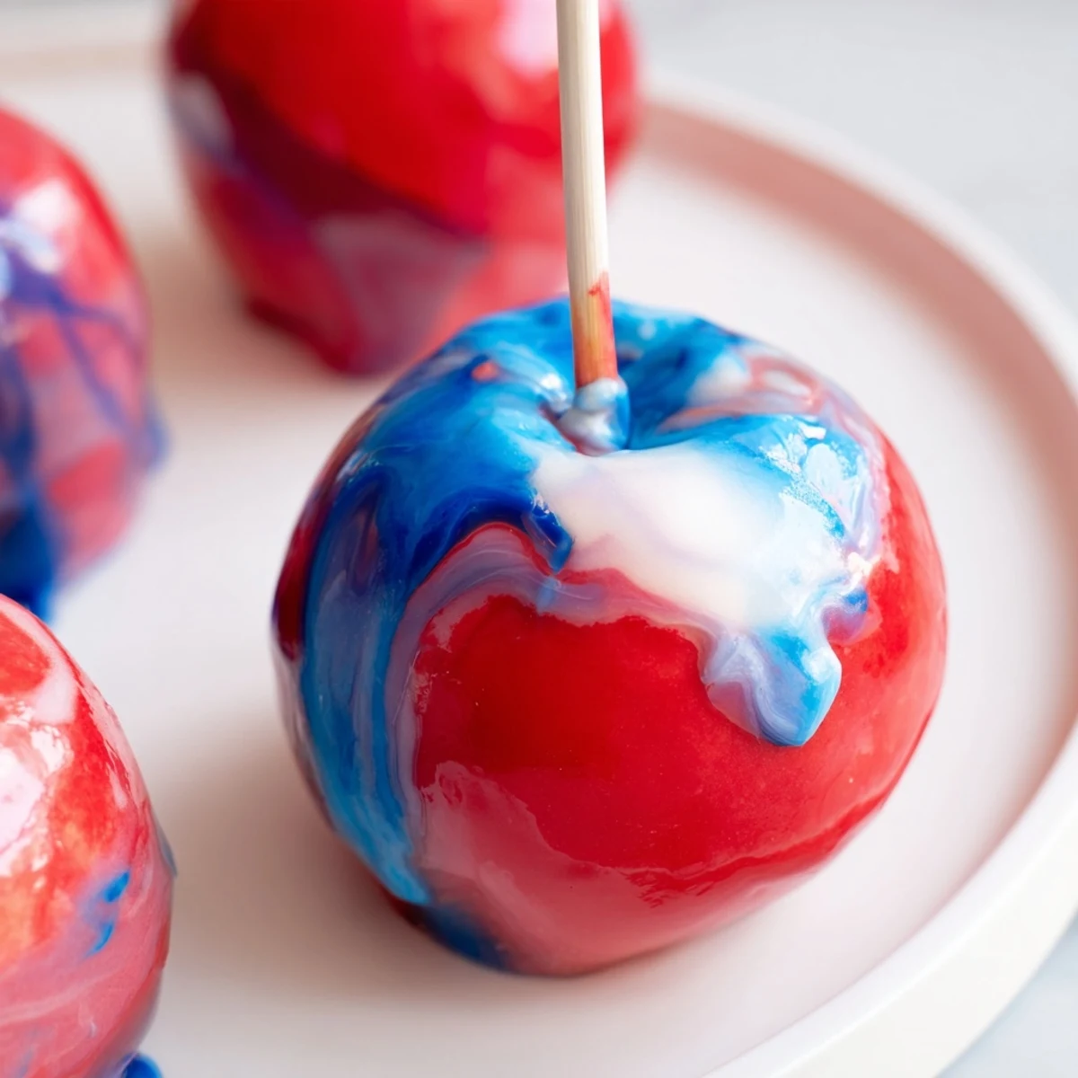 Marbled Effect Candy Apples on a tray with glossy candy swirls, perfect for Halloween parties and festive events.