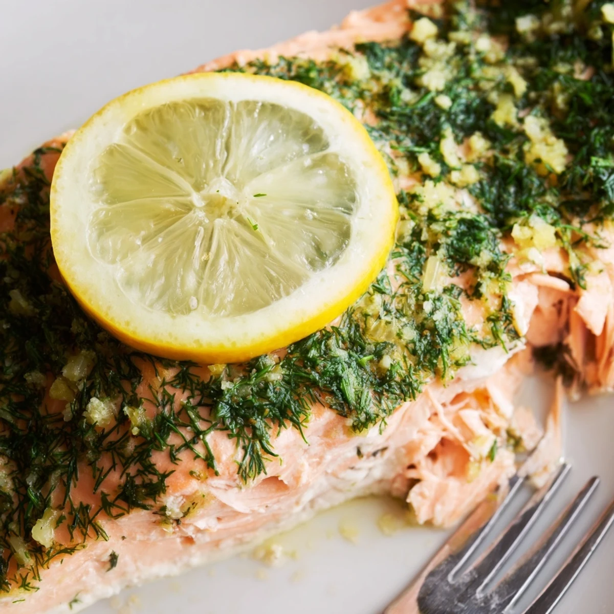 Oven-baked salmon with aromatic dill and citrus lemon seasoning perfectly cooked to flaky perfection