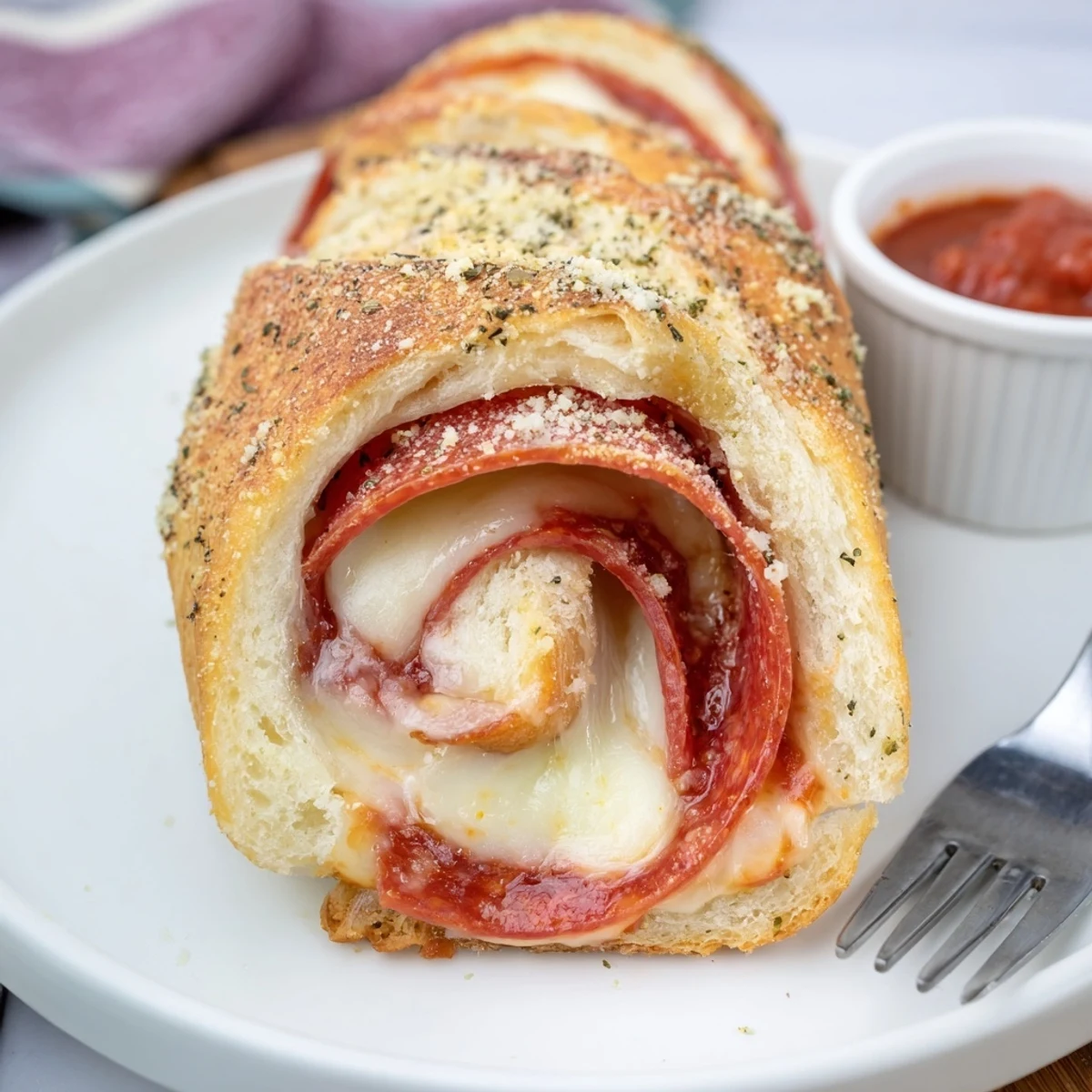 Pepperoni Pizza Roll Breadsticks golden, cheesy swirls steaming, served with marinara