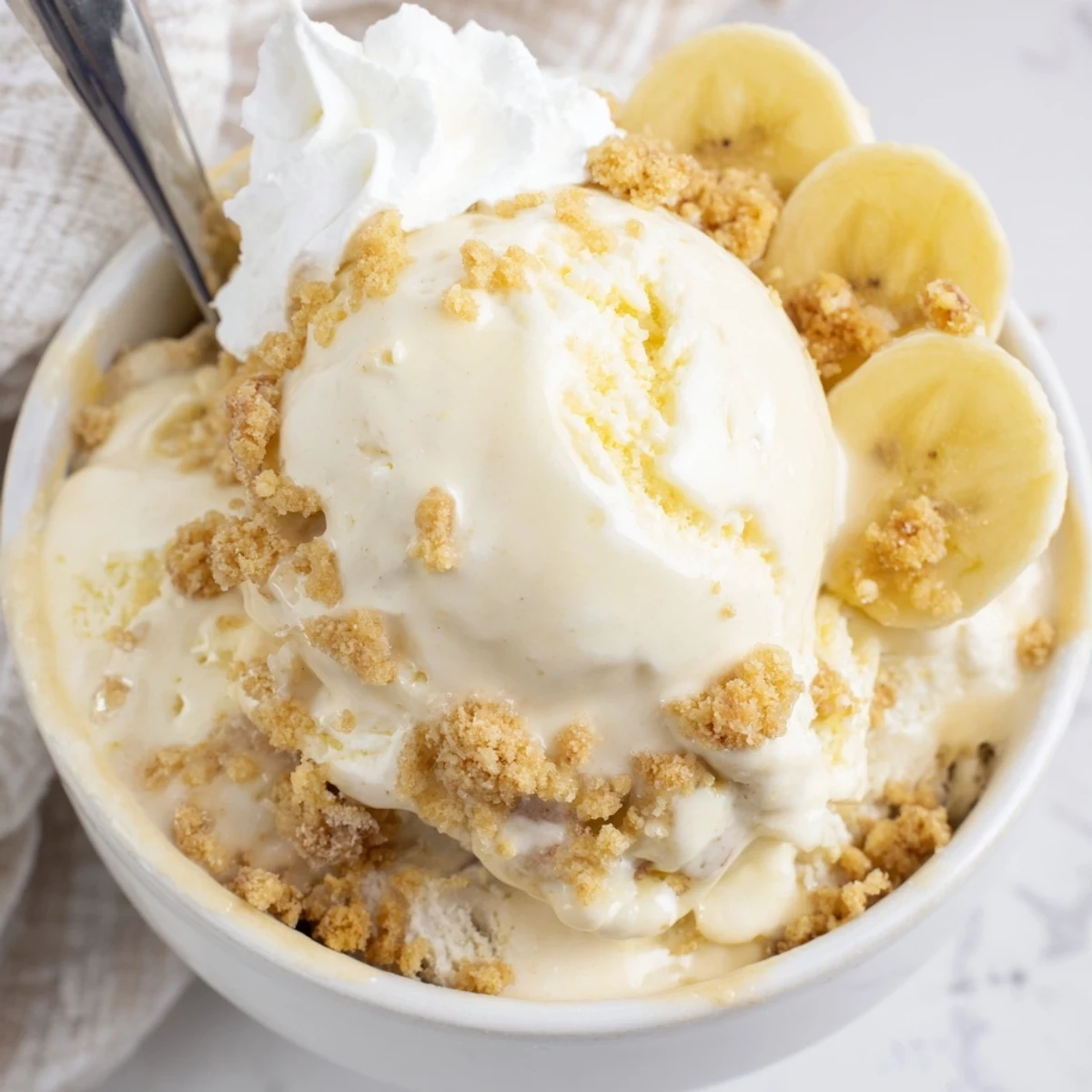 Ninja Creami Banana Cream Pie Ice Cream with graham swirl and whipped cream