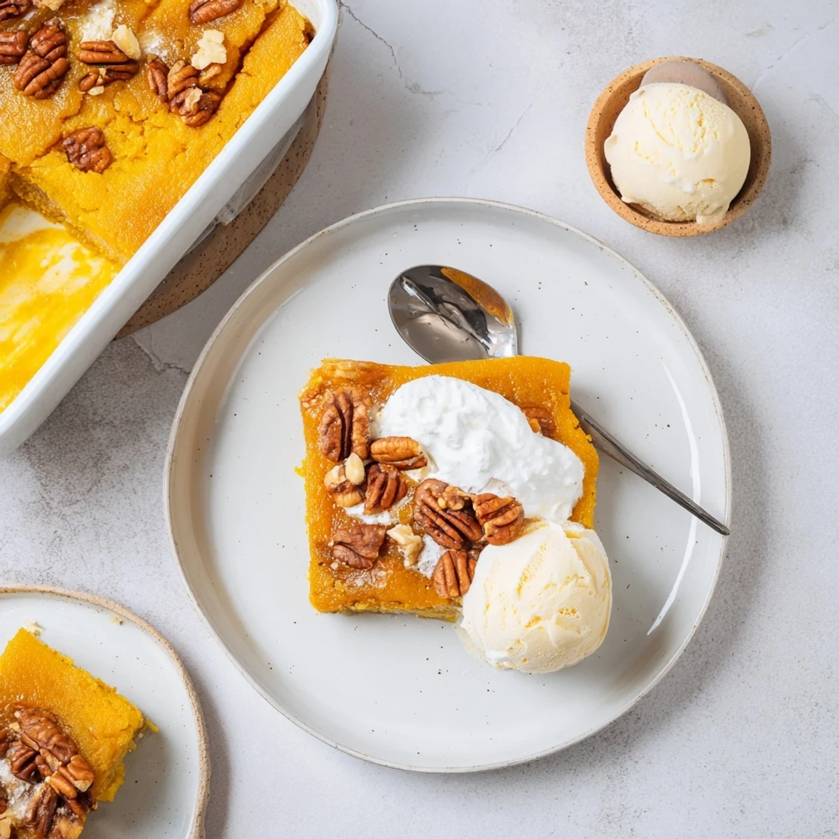 Bubbly Pumpkin Dump Cake cooling in 9x13 pan, buttery cake crumbs visible