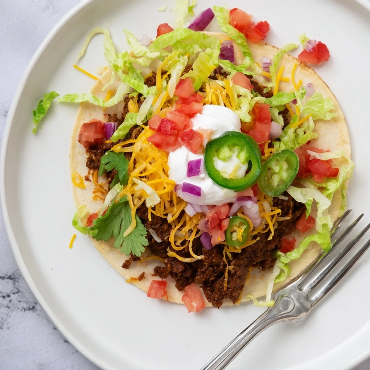 Savory smashed beef patties layered with gooey Monterey Jack atop warm corn tortillas