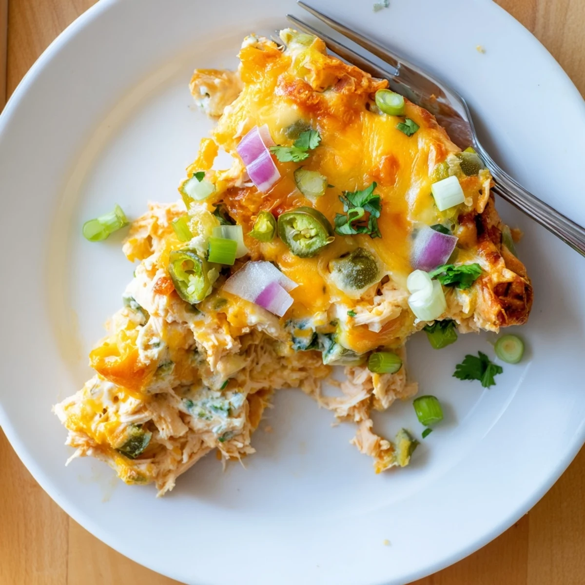 Creamy jalapeno buffalo chicken casserole with tender shredded chicken, spicy buffalo sauce, and gooey melted cheese